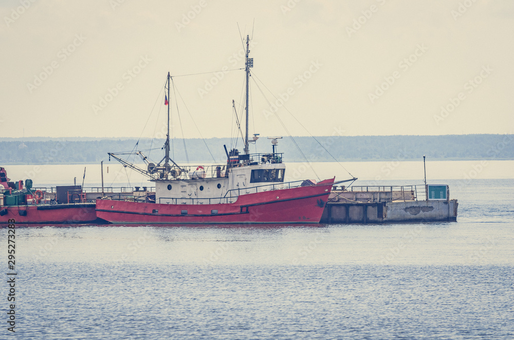 Small boats moored to the pier