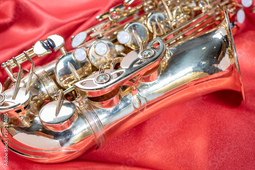 Photography Beautiful macro photo of the details of a wind instrument of a golden alto saxop