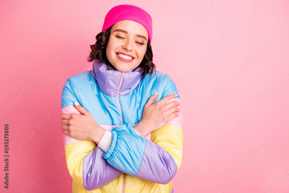 Closeup photo of beautiful lady holding hands warm colored coat isolated pink background Closeup photo of beautiful lady holding hands warm colored coat isolated pink background