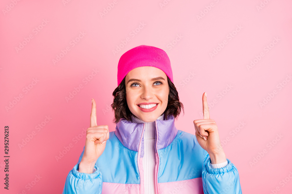 Photo of nice lady indicating hands up empty space wear warm colored coat isolated pink background Photo of nice lady indicating hands up empty space wear warm colored coat isolated pink background