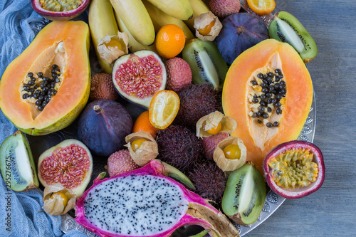 assorted exotic fruits on a gray background close-up