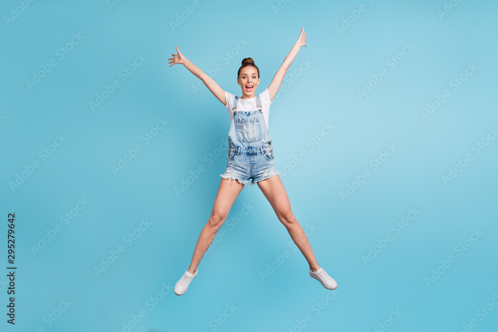 Full length body size photo of charming fascinating enjoying positive girl stretching away while isolated with blue background