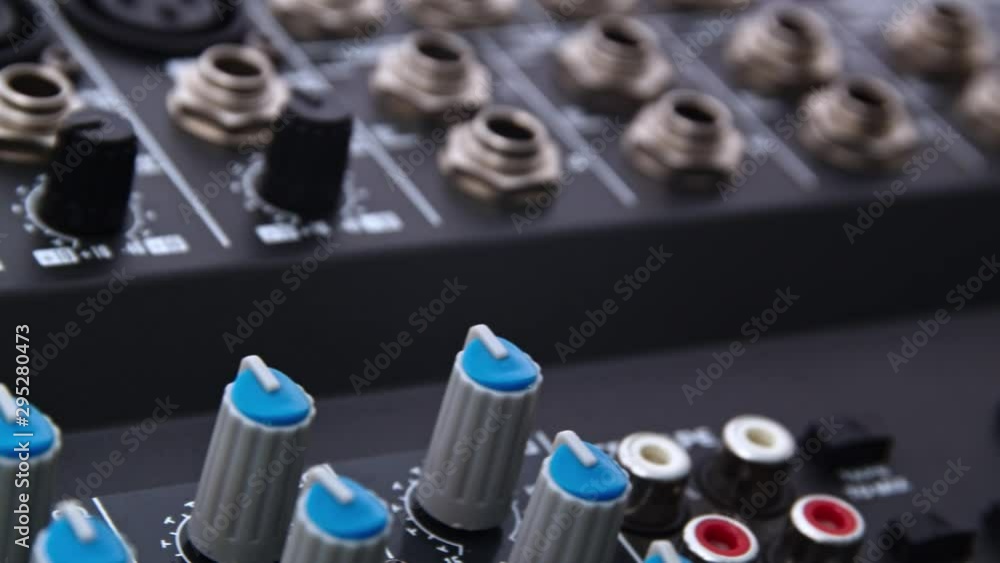 Professional audio mixer knobs input/output ports moving closeup Professional audio mixer knobs input/output ports moving closeup