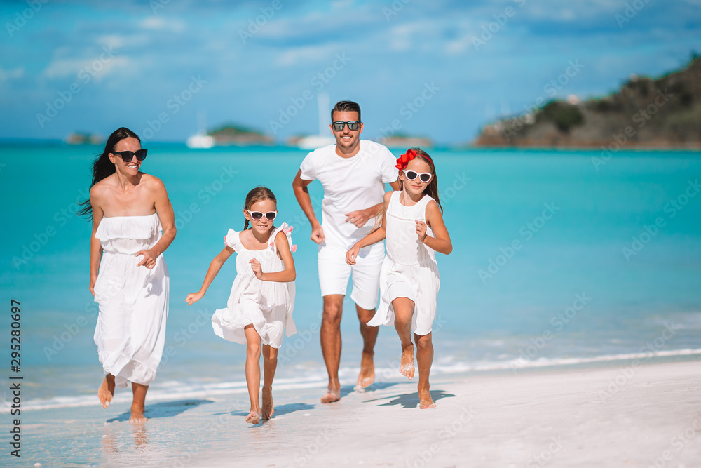 Young family of four on vacation have fun Young family of four on vacation have fun