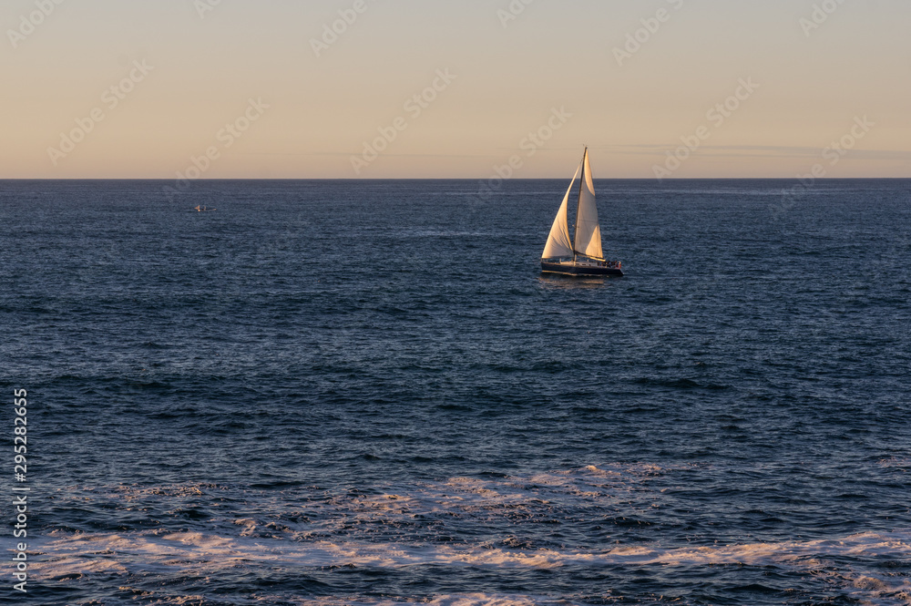 A boat on the sea at sunset