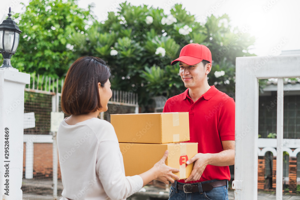 Asian delivery man deliver box parcel package to customer at home, shipping delivery concept Asian delivery man deliver box parcel package to customer at home, shipping delivery concept