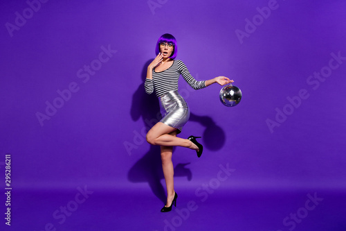 Full length photo of cute impressed person shout unbelievable wear eyeglasses eyewear hold mirror ball isolated over purple violet background