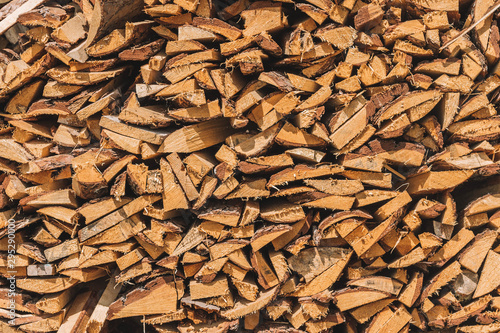 stacks of firewood. firewood for the winter, .dry chopped pile of firewood. wall of fire wood background.