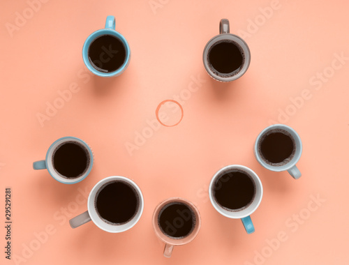 Coffee in the different cups on the beige background. Flatlay, cheerful day concept