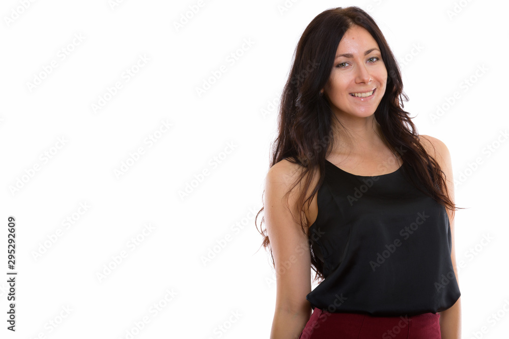 Studio shot of young happy businesswoman smiling Studio shot of young happy businesswoman smiling