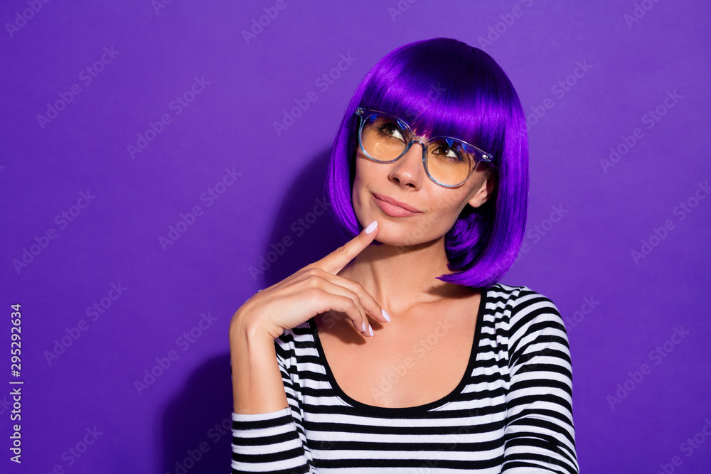 Photo of amazing lady touch chin finger look up empty space wear bright wig striped pullover isolated purple background Photo of amazing lady touch chin finger look up empty space wear bright wig striped pullover isolated purple background