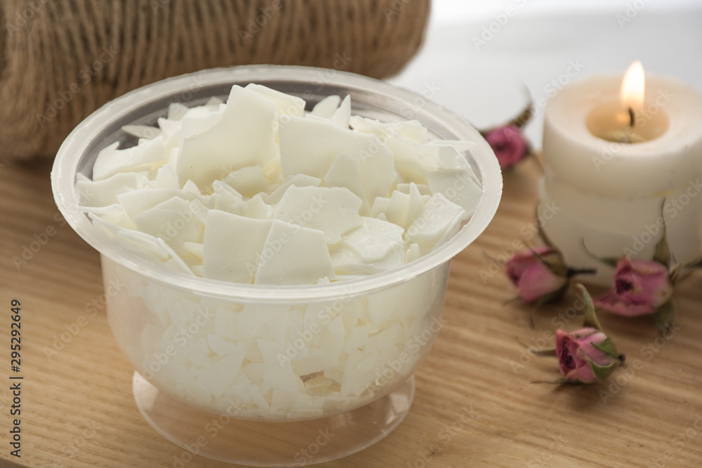 Close up of soy wax. Candle making from soy wax - ingredients for handmade candles on white background. Natural decor. Ecological candles. Front view Close up of soy wax. Candle making from soy wax - ingredients for handmade candles on white background. Natural decor. Ecological candles. Front view