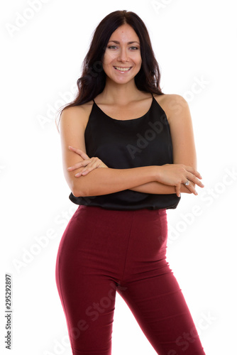 Studio shot of young happy businesswoman smiling and standing wi © Ranta Images