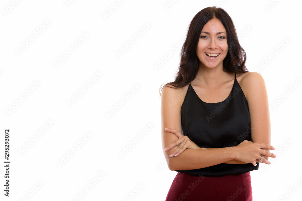 Studio shot of young happy businesswoman smiling with arms cross Studio shot of young happy businesswoman smiling with arms cross
