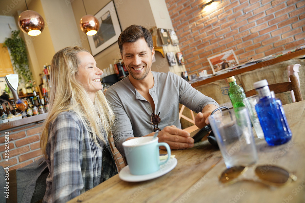 Middle-aged couple sitting at coffee shop Middle-aged couple sitting at coffee shop