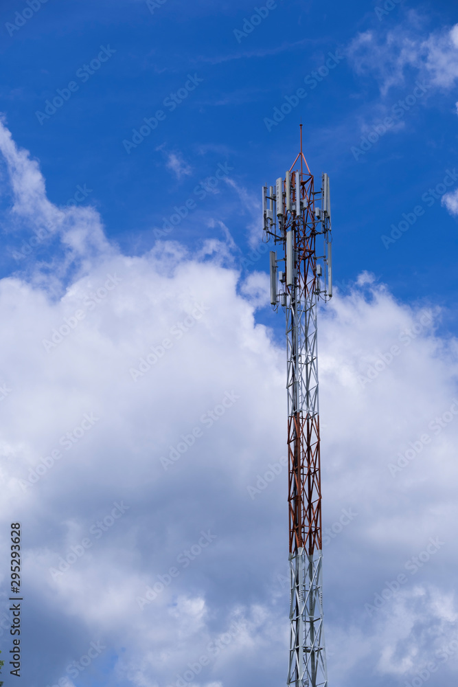 Telecommunication telephone signal transmission tower with beautiful blue sky and cloudy background Telecommunication telephone signal transmission tower with beautiful blue sky and cloudy background