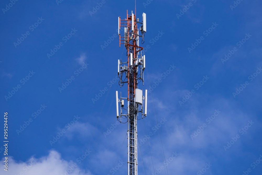 Telecommunication telephone signal transmission tower with beautiful blue sky and cloudy background Telecommunication telephone signal transmission tower with beautiful blue sky and cloudy background