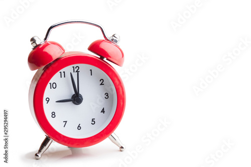 Red alarm clock isolated on white background