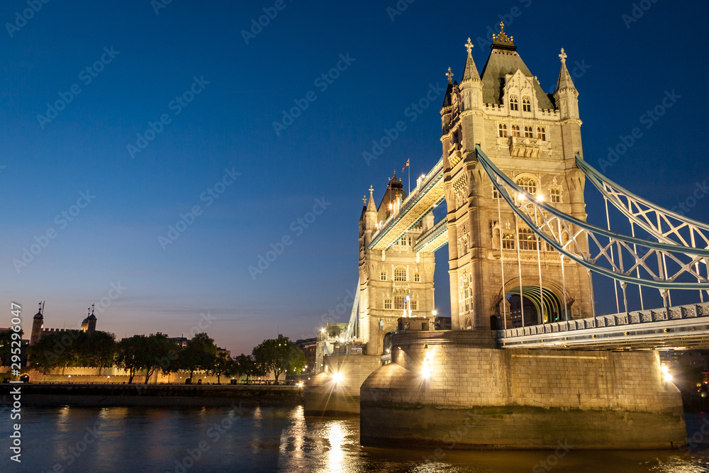Tower Bridge and the River Thames, London. A dusk view over the River Thames with the iconic landmark Tower Bridge dominating the scene.