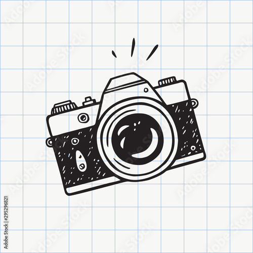 Photo camera doodle icon. Hand drawn sketch in vector photo