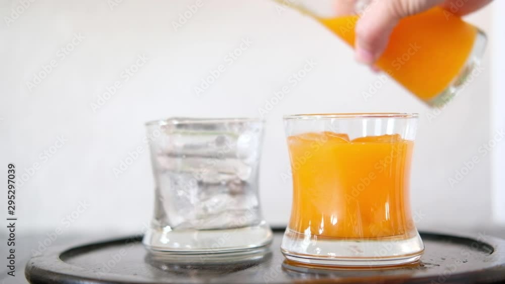 glass of orange juice on table glass of orange juice on table