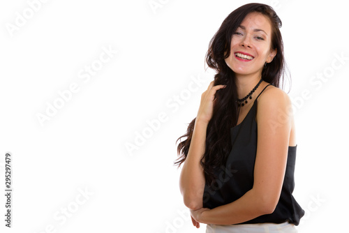 Studio shot of young happy businesswoman smiling while touching © Ranta Images