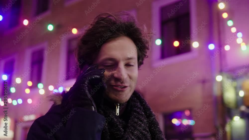 Man with a mobile phone on a cold winter evening Man with a mobile phone on a cold winter evening