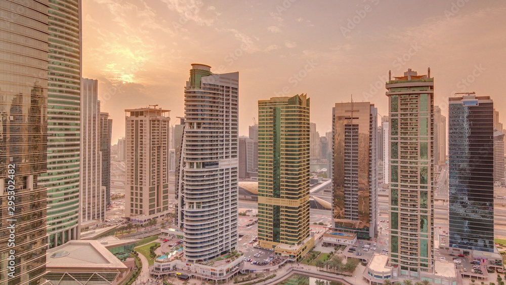 Fototapeta premium Residential and office buildings in Jumeirah lake towers district timelapse in Dubai