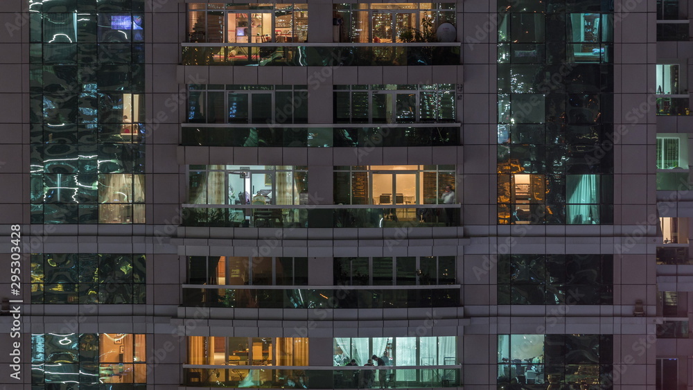 Night view of exterior apartment building timelapse. High rise skyscraper with blinking lights in windows Night view of exterior apartment building timelapse. High rise skyscraper with blinking lights in windows