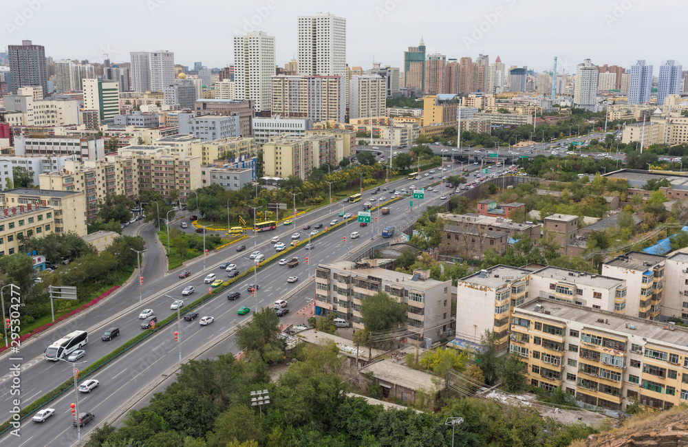 Naklejka premium Urumqi, China - capital of the Xinjiang Uygur Autonomous Region, Urumqi displays several wonderful landmarks. Here in particular the city's skyline