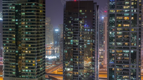 Residential and office buildings in Jumeirah lake towers district night timelapse in Dubai