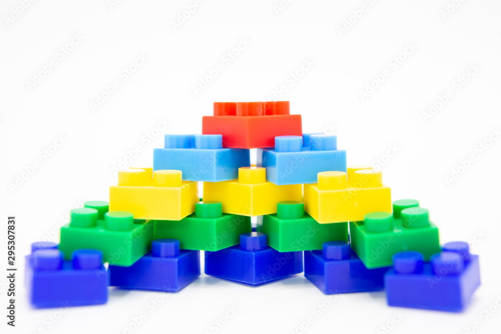 brick blocks stairs tower cubes toy mini figures colorful on white background . building plastic fun collection for child . infographic geometric template concept with white copy space. brick blocks stairs tower cubes toy mini figures colorful on white background . building plastic fun collection for child . infographic geometric template concept with white copy space.