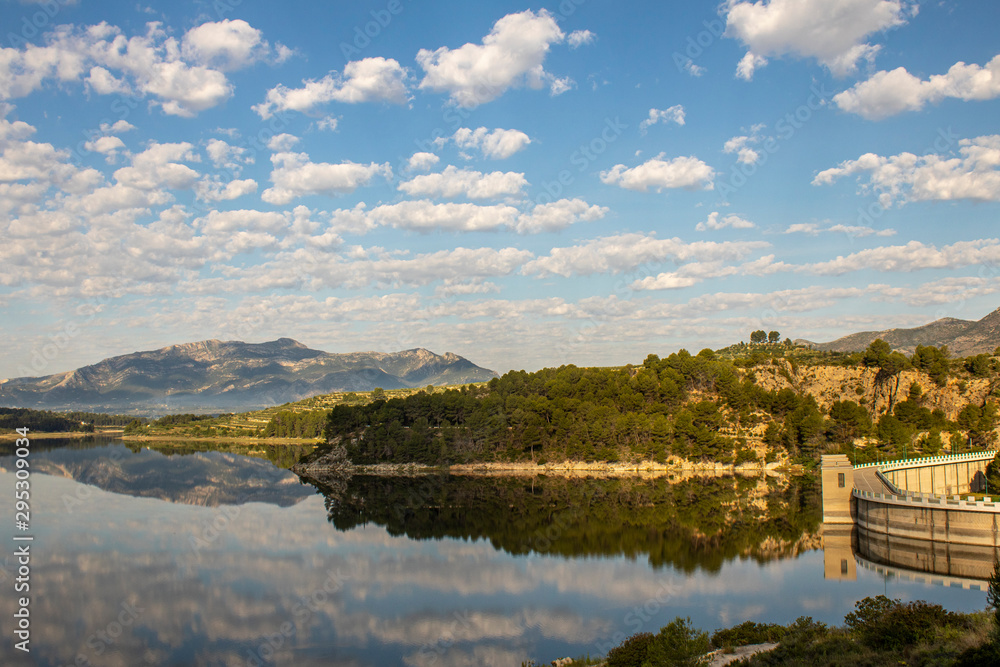 Fototapeta premium Swamp of Beniarres one day with white clouds reflected in the water.