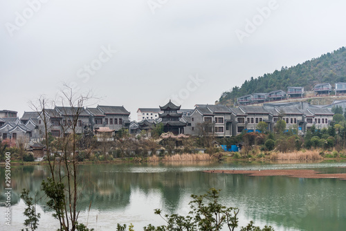 Ming Qing Dynasty Chinese traditional rural house at the lakeside, in Qingyan Ancient town, one of famous old town and popular travel destination in Guiyang, Guizhou Province, China. © zz3701
