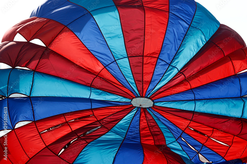 Fototapeta premium flying Water parachute umbrella on the sky background.