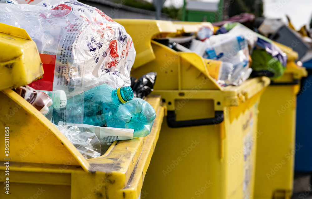 Yellow dustbins full of garbage which has not been emptied Stock Photo Adobe Stock