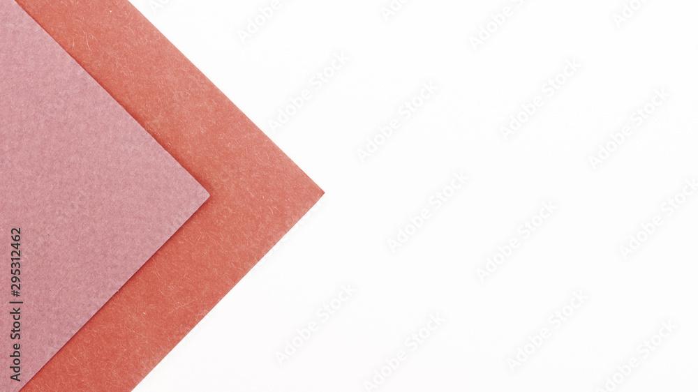 Fototapeta premium Pink triangular cardboard sheets with copy space