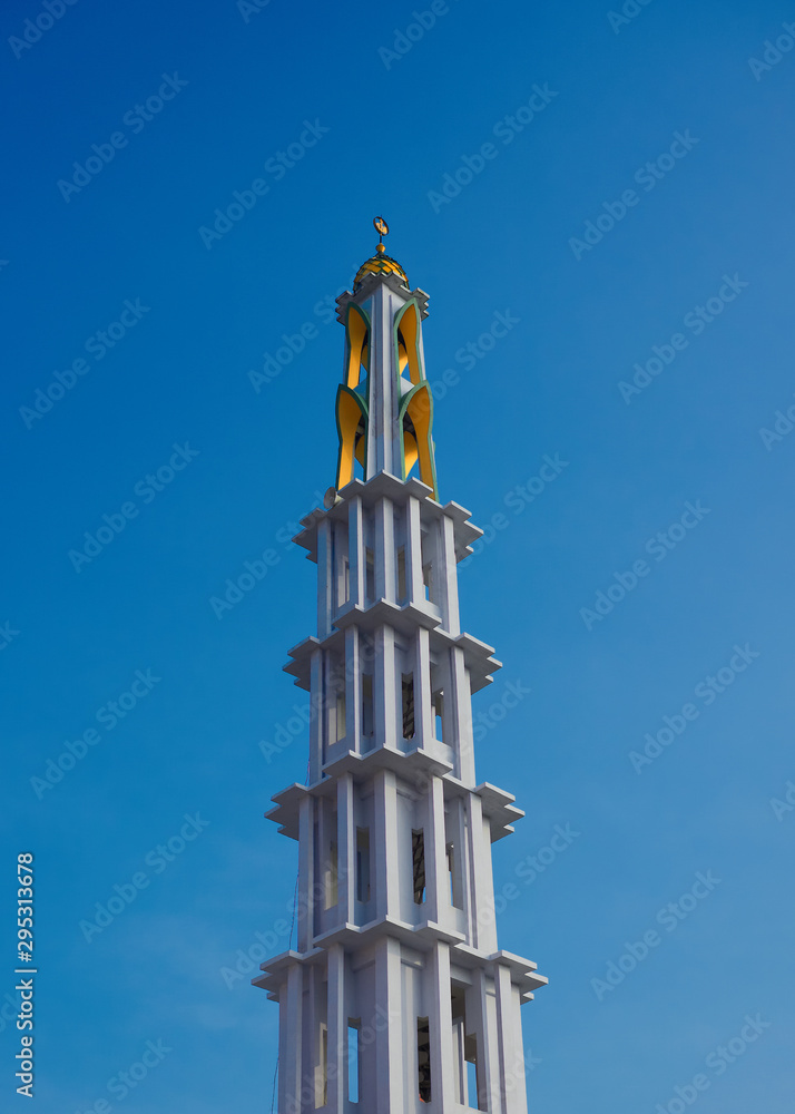 tower mosque isolated on blue sky background tower mosque isolated on blue sky background