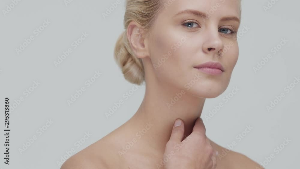 Studio portrait of young, beautiful and natural blond woman applying skin care cream. Face lifting, cosmetics and make-up. Studio portrait of young, beautiful and natural blond woman applying skin care cream. Face lifting, cosmetics and make-up.