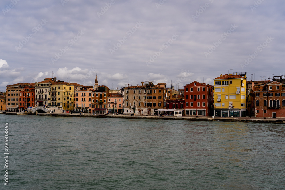 city coastline of Venice Italy Europe. beautiful city of Venice shot from a ferry. skyline of Venice during a cloudy sunrise