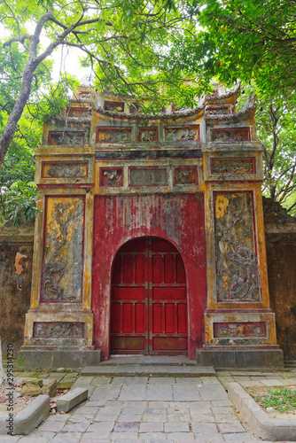 Colorful decorated closed gate to the inner area of Purple Forbidden city (Imperial Citadel) in Hue, Vietnam