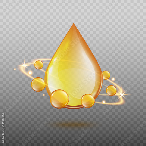 Golden oil drop with magic light energy swirl surrounded by sphere gold droplets