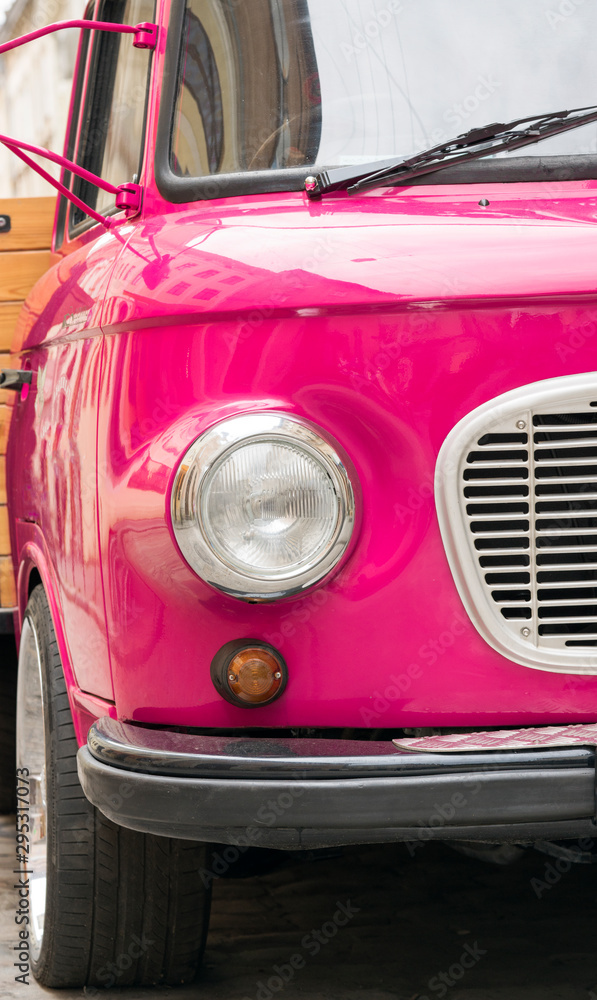 Retro pink car close up.