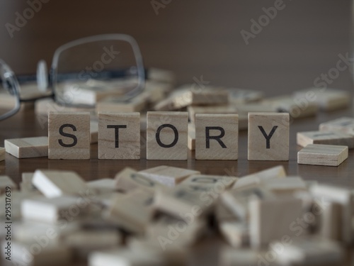 The concept of Story represented by wooden letter tiles photo
