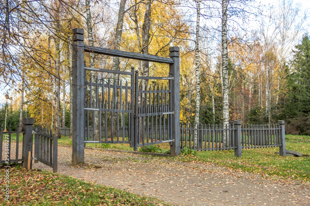 The old wooden fence and gate in autumn. The old wooden fence and gate in autumn.