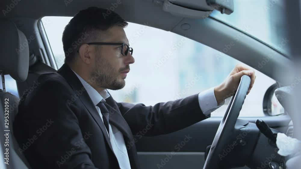 Driver of car changing paper handkerchief suffering from runny nose cold symptom Driver of car changing paper handkerchief suffering from runny nose cold symptom