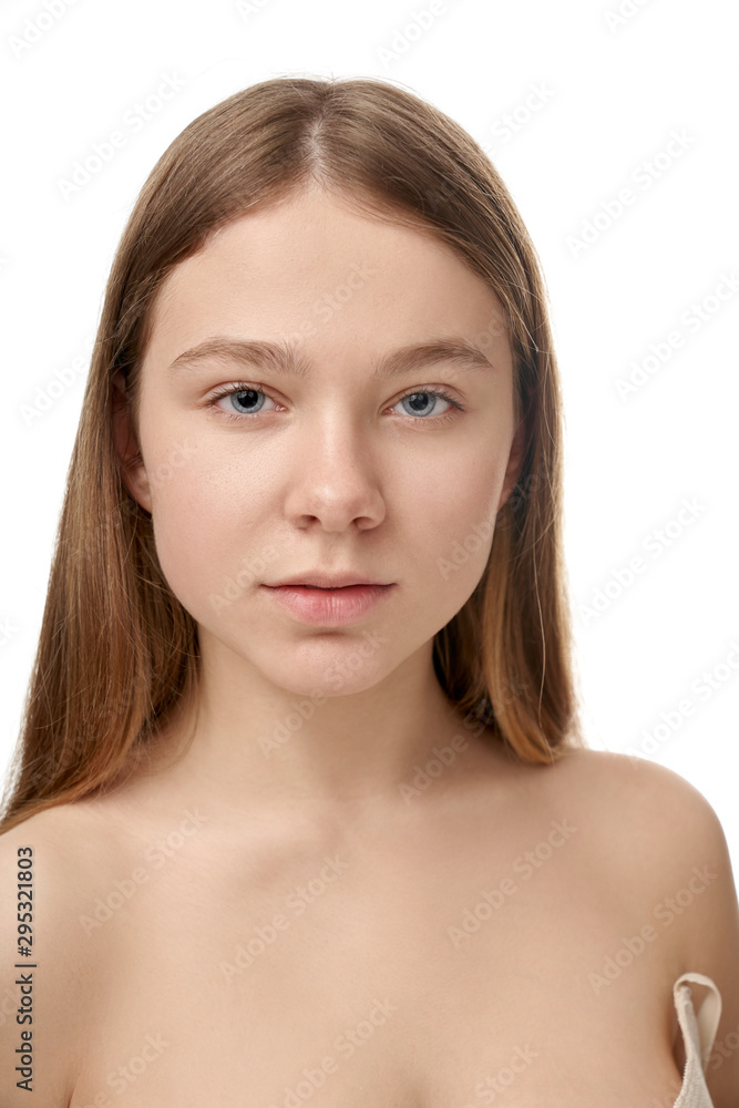 Portrait of attractive girl without makeup looking at camera Portrait of attractive girl without makeup looking at camera