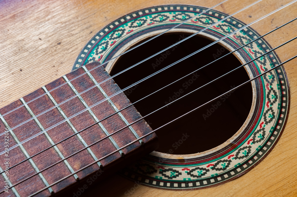 Obraz premium six strings on an old worn guitar