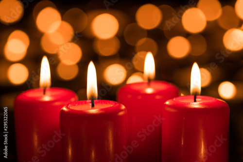 Four burning candles on the Fourth Sunday in Advent 