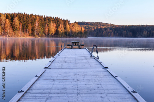 pier on the lake in the morning photo